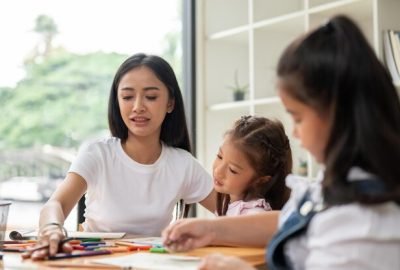 beautiful-asian-female-teacher-babysitter-is-teaching-art-young-kids-home_67155-37793